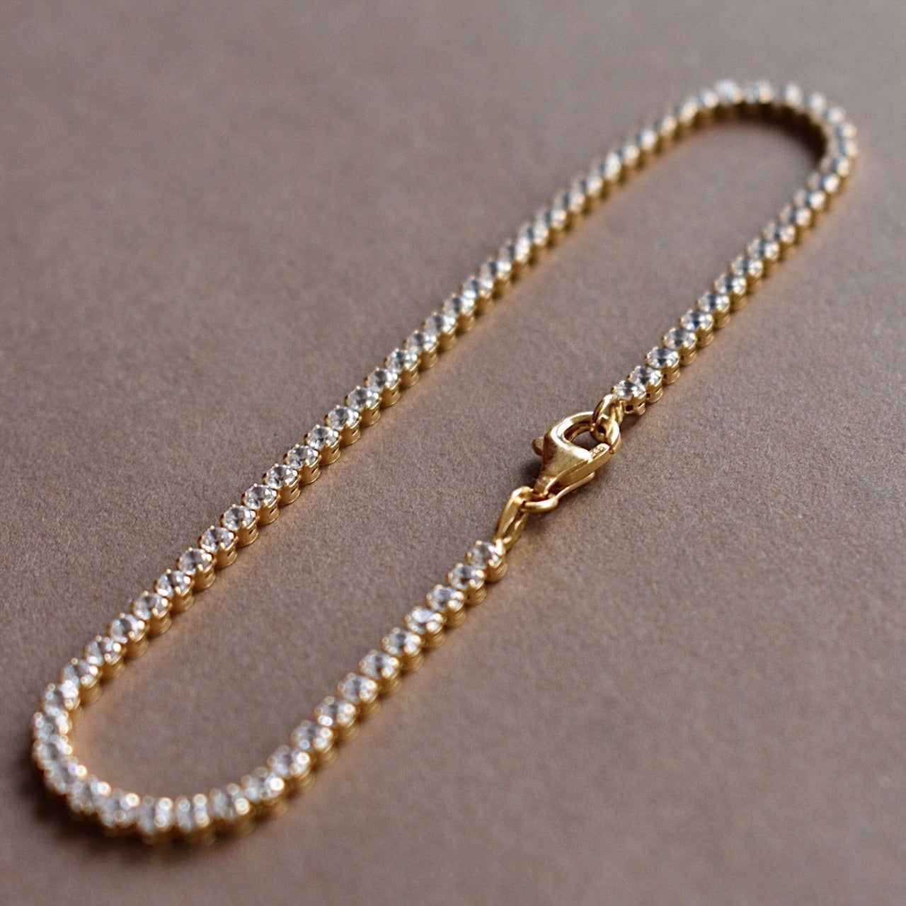 lala gold tennis bracelet with white cz diamonds